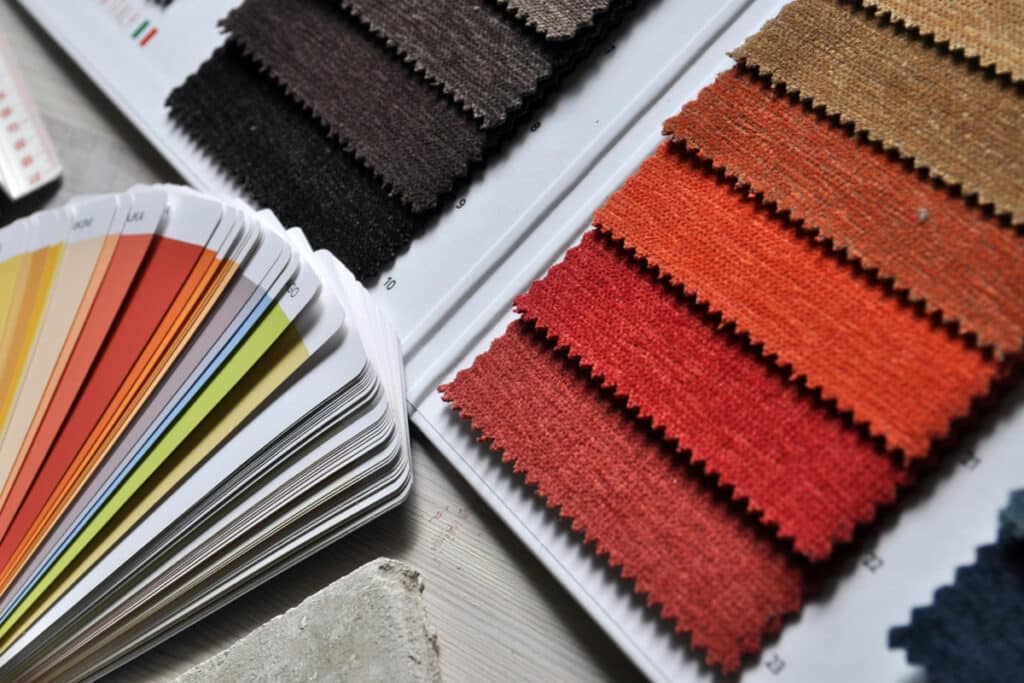 Color swatches and material samples laid out for project planning by a licensed general contractor.