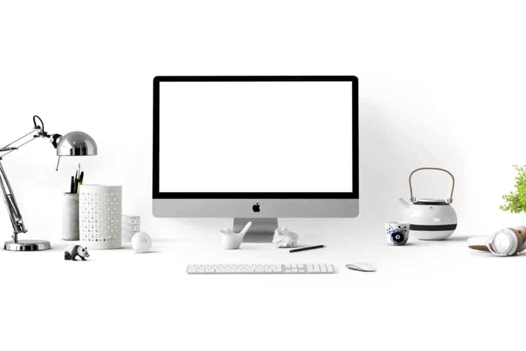 Desktop workspace with a blank computer screen, representing contractor estimating software setup.