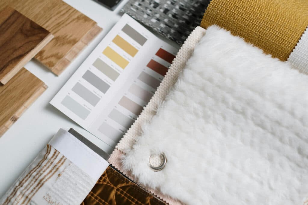 Material and color samples laid out on a table, reflecting design choices in home services industry trends in 2025.